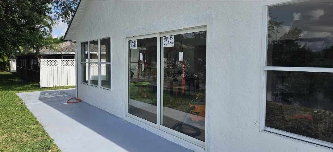 New impact windows and sliding glass door installed on a South Florida home
